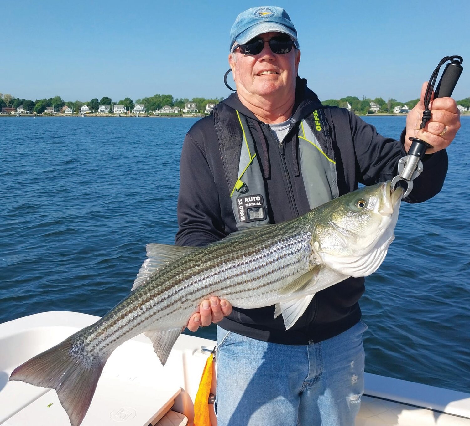 STRIPER BITE STRONG: Angler Bob Donald of North Kingstown caught bass to 33 inches trolling tube & worm north of Conimicut Light. An influx of pogies enhanced the striper bite last week.